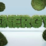 3D render of the word 'ENERGY' covered in grass, symbolizing green energy and sustainability.